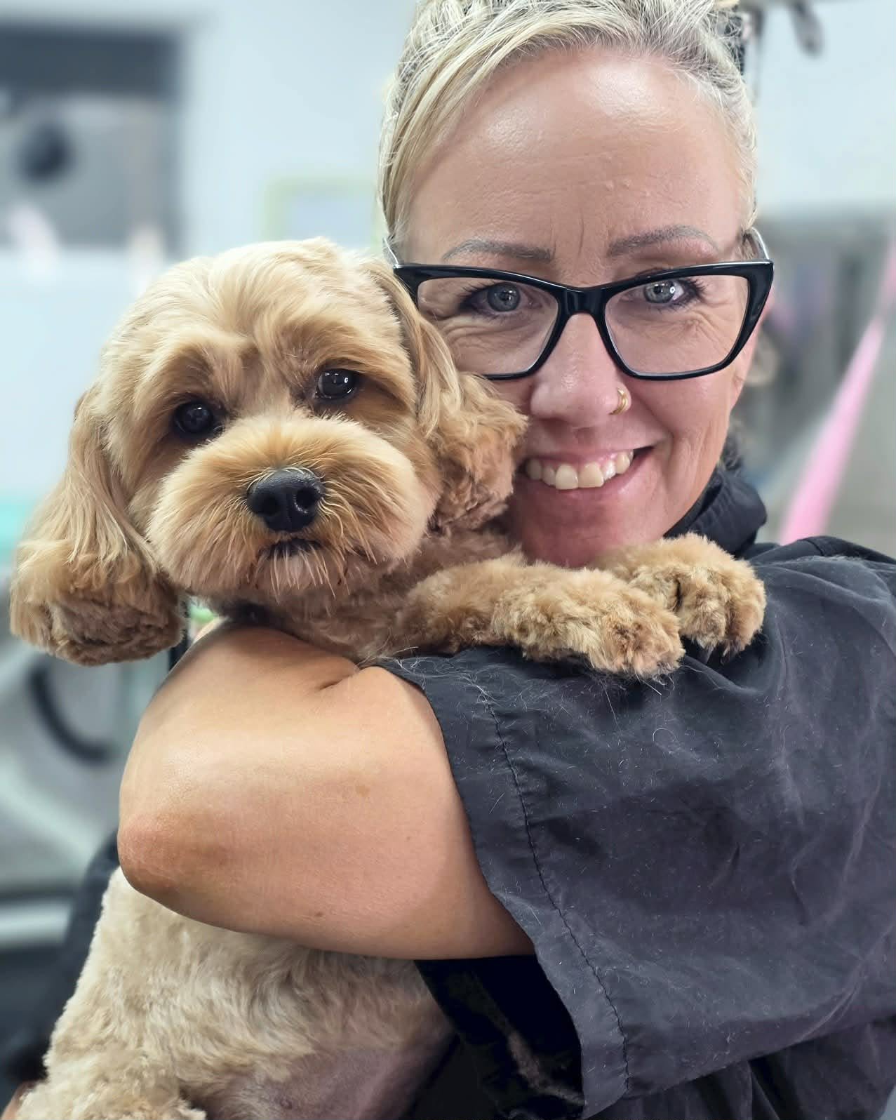 Jodie with a freshly groomed cavapoo at Jodie's Groom Room