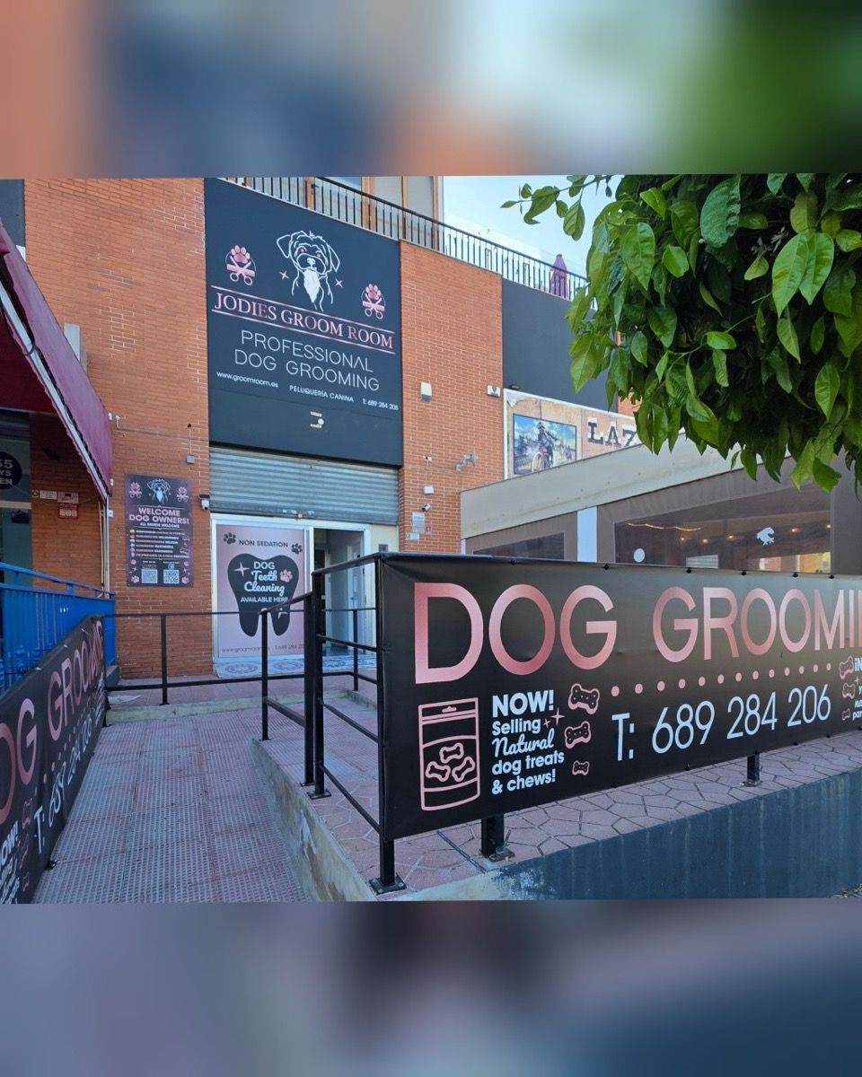 Exterior storefront and street signage of Jodie's Groom Room in San Fulgencio, Alicante, Spain